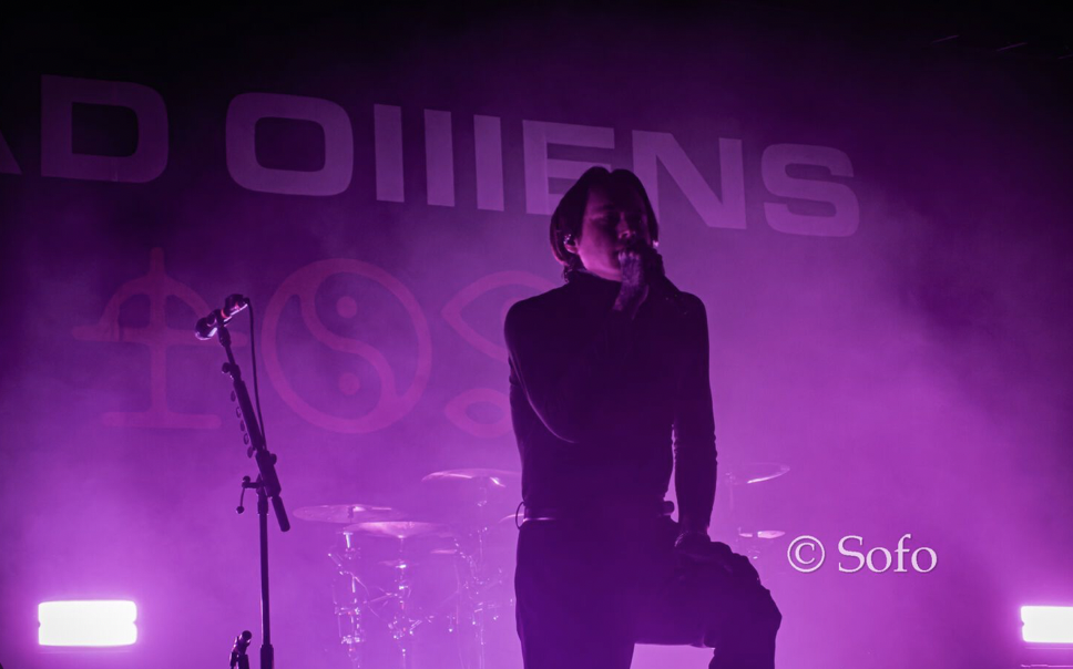 Noah Sebastian of Bad Omens performing on stage with purple lighting. Photo from https://pixelfed.de/p/photogra.fairy/543073957249825307
